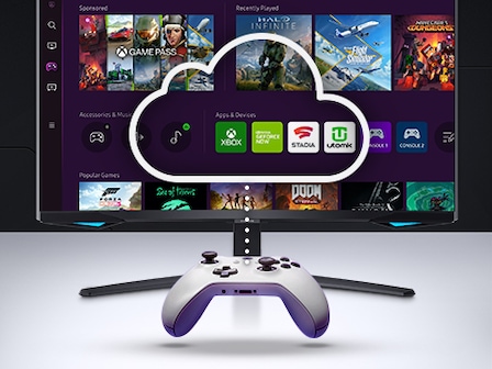 A gaming controller floats in front of a gaming monitor. The screen shows a variety of gaming content and game selections.