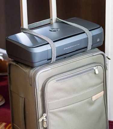 Carry mobile printer along with travel bag